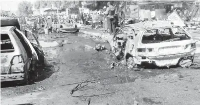  ??  ?? The scene of a bomb blast at the Post Office area in Maiduguri Tuesday