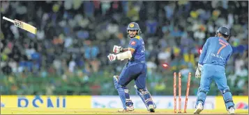  ??  ?? Sri Lanka's Dilshan Munaweera looses his bat as he was bowled by India's Kuldeep Yadav during their Twenty20 match in Colombo, Sri Lanka, on Wednesday