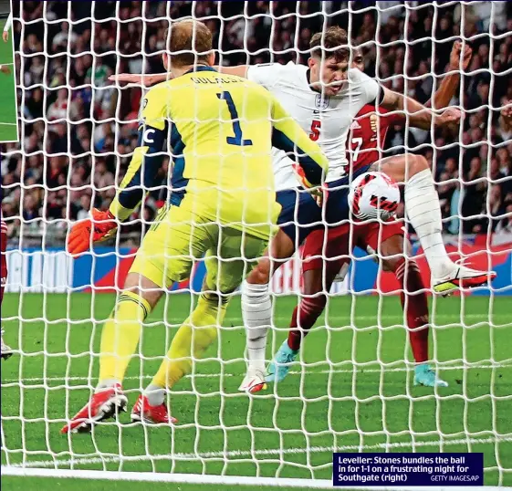  ?? GETTY IMAGES/AP ?? Leveller: Stones bundles the ball in for 1-1 on a frustratin­g night for Southgate (right)