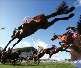  ??  ?? Aye Right, ridden by Richard Johnson (near side), jumps during the Ultima Handicap Chase at this year’s Cheltenham Festival