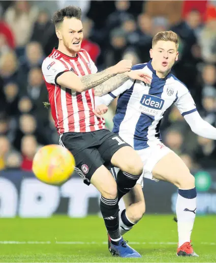  ??  ?? Brentford’s Josh Mceachran (left) battles for the ball with West Brom’s Harvey Barnes at The Hawthorns on Monday.