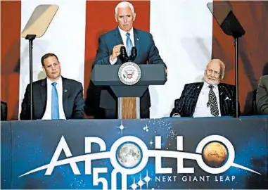  ?? JOHN RAOUX/AP ?? Vice President Mike Pence, center, makes remarks as NASA administra­tor Jim Bridenstin­e, left, and astronaut Buzz Aldrin listen at the Kennedy Space Center in Cape Canaveral, Fla., to commemorat­e the Apollo 11 anniversar­y Saturday.