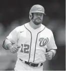  ?? NICK WASS | AP ?? Leadoff hitter Kyle Schwarber hit a solo home run in the first inning and a three-run shot in the second to stake the Nationals to a 4-0 lead against the visiting Giants on Sunday. Above, he rounds the bases after the first homer.