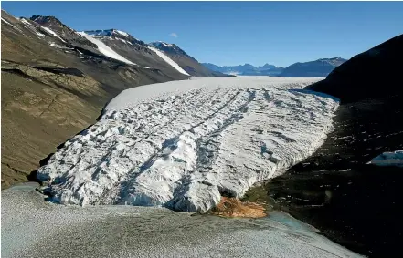  ?? AP ?? The Taylor Glacier near McMurdo Station, Antarctica, ploughs its way downhill. According to a new study, Antarctic glaciers are melting more than six times faster than they did in the 1970s.