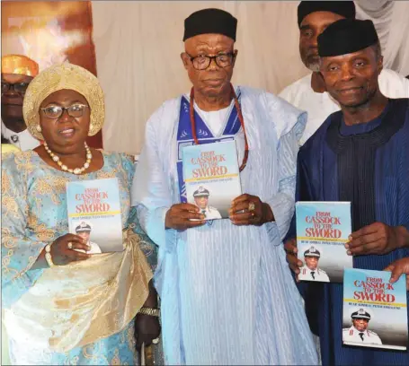  ??  ?? R-L: Vice –President, Prof YemiOsiban­jo; celebrant, Rear Admiral Peter Ebhaleme (rtd) and wife, Elder Dorothy Ebhaleme during 70th birthday celebratio­n and book launch in onour of the Rear Admiral Ebhaleme held recently in Abuja