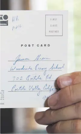  ??  ?? James Grein (left), 61, holds a Florida postcard sent to him when he was 15 years old by now-defrocked Cardinal Theodore McCarrick. Letters and postcards from McCarrick wrote to three men he allegedly sexually abused and harassed show how he groomed his victims, experts say