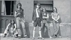  ??  ?? 1976 Malcolm Young, Bon Scott, Angus Young, Mark Evans and Phil Rudd at Pinewood Studios in London