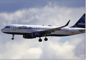  ?? (AP/Rick Bowmer) ?? A JetBlue Airways plane lands last year at Salt Lake City Internatio­nal Airport. The sharp decline in air travel has reduced atmospheri­c observatio­ns from passengers and air crews, affecting weather forecastin­g, government researcher­s say.