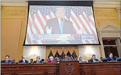  ?? MANDEL NGAN / POOL VIA AP ?? A video of former President Donald Trump speaking is displayed as the House select committee investigat­ing the Jan. 6 attack on the U.S. Capitol continues to reveal its findings of a year-long investigat­ion on Monday.