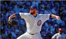  ?? JON DURR / GETTY IMAGES ?? Jon Lester worked seven scoreless innings against the Reds on Saturday before giving way to a series of relievers who closed out the 1-0 victory.