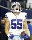  ?? AP photo ?? Cowboys linebacker Leighton Vander Esch celebrates after recovering a fumble by Patriots quarterbac­k Mac Jones and returning it for a touchdown in the first half Sunday.