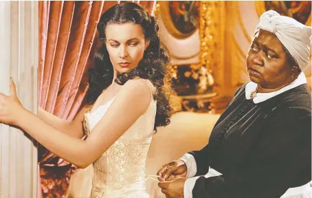  ??  ?? Vivien Leigh as Scarlett O’hara and Hattie Mcdaniel as Mammy in 1939’s Gone with the Wind. Mcdaniel won the Best Supporting Actress Oscar.