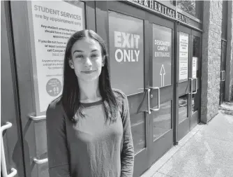  ?? NICOLE SULLIVAN • CAPE BRETON POST ?? Cape Breton University Students’ Union president Madlyn O’Brien stands outside one of the school’s entrances on Thursday, less than two weeks before CBU opens for in-person classes — part of level four of the university’s Return to Campus plan.