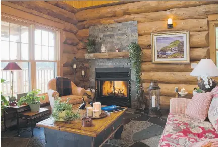  ??  ?? The cabin, located near St-Donat, is built from spruce, instead of Eastern white pine. All the floors in the home are equipped with a heating system. Slate is used on the ground floor, as well as around the wood-burning fireplace in the living room and...