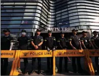  ?? AP/LEE JIN-MAN ?? South Korean police officers guard the Japanese Embassy in Seoul on Thursday as demonstrat­ors rally in favor of ending an intelligen­ce-sharing agreement with Japan.