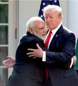  ??  ?? Prime Minister Narendra Modi and US President Donald Trump hug each other at the White House in Washington D.C. on Tuesday. — PTI