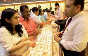  ?? File photo ?? The main reason for the tight relationsh­ip between the dollar and gold is a lack of physical demand on the gold side in terms of exchange-traded funds and Indian and Chinese jewellery. —