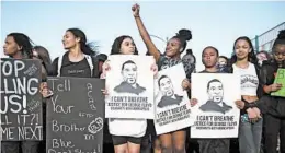  ?? SEAN MEAGHER/THE OREGONIAN ?? Young marchers protesting George Floyd’s death are seen Tuesday in Portland, Oregon.