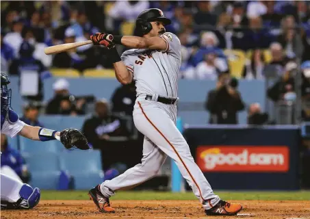  ?? Carlos Avila Gonzalez / The Chronicle 2021 ?? Outfielder LaMonte Wade Jr., who hit 18 home runs last season, was penciled in as the Giants’ leadoff man Friday night.