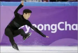  ?? BERNAT ARMANGUE - THE ASSOCIATED PRESS ?? The United States’ Nathan Chen falls in the men’s single short program team event at the 2018 Winter Olympics in Gangneung, South Korea, Friday.