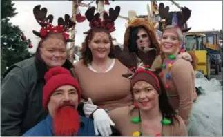  ?? BY PAUL POST ?? A group of family members and friends dressed up with colorful reindeer-themed costumes. They are Tom Matteson and Nicolle Field, front; and Sonja Matteson, Mariah Edwards, Travis Augusta and Megan Matteson, back.