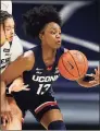  ?? Gary Landers / Associated Press ?? UConn guard Christyn Williams, right, takes control of a loose ball in front of Xavier guard Shaulana Wagner during the first half on Saturday.