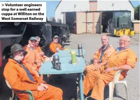  ??  ?? Volunteer engineers stop for a well earned cuppa at Williton on the West Somerset Railway