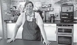  ?? TOM WILKINSON AP ?? Caroline Atkinson, owner of the Rose Coffee House, prepares to reopen, in Belmont, Durham, England, last week. As Britain prepares for a major step out of lockdown, officials are anxious about a more contagious variant spreading in the country