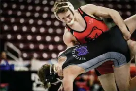  ??  ?? Boyertown’s Brett Breidor takes Mifflin County’s Anson Wagner to the mat before pinning him in the third period at 152 pounds.