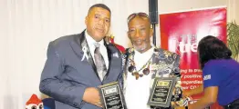  ?? NICHOLAS NUNES/PHOTOGRAPH­ER ?? Wayne Bartley (left) and Audley Malcolm shows off their Outstandin­g Father Awards received at the Internatio­nal Men’s Day Observance and Celebratio­n Forum 2020 at The Jamaica Pegasus Hotel in New Kingston yesterday.