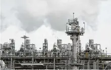  ?? Yi-Chin Lee / Staff file photo ?? Chevron Phillips Chemical’s cracker unit is in Baytown. The impact of climate change has shareholde­rs concerned.