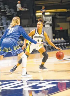  ?? PHOTO BY FRANK MATTIA/UTC ATHLETICS ?? UTC guard Mya Long runs the Mocs’ offense against South Dakota State on Tuesday night at McKenzie Arena. Long scored 12 points in the Mocs’ 71-54 loss.