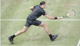  ?? THE ASSOCIATED PRESS ?? Milos Raonic returns the ball to Lucas Pouille in their semifinal match during the ATP Mercedes Cup in Stuttgart on Saturday.