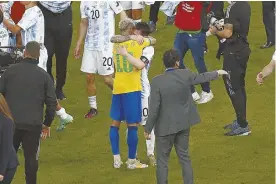  ?? ?? Lionel Messi consoles Neymar after Argentina beat Brazil in the 2021 Copa America final at the Maracana Stadium.