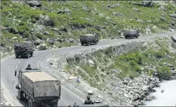  ??  ?? A convoy of the Indian Army moves along a highway in Ganderbal of Jammu and Kashmir on its way to Ladakh, on June 17, following a face-off with the PLA.