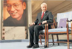  ?? HEIKO JUNGE/THE ASSOCIATED PRESS FILE PHOTO ?? Lui Xiaobo’s award was placed on an empty chair in a bold statement about his absence.