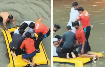  ?? ?? Above: A group of men rescuing people trapped in a vehicle on a flooded street. A video of them breaking open the sunroof and pulling out passengers went viral on social media. Right: Volunteers united through the UAE Rain Support WhatsApp group to distribute food packets.