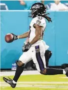  ?? LYNNE SLADKY/ASSOCIATED PRESS ?? Ravens running back De'Lance Turner scores a touchdown on a 65-yard run in the second quarter of the a preseason game against the Dolphins.