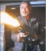  ?? Kerry Brown / Associated Press ?? Arnold Schwarzene­gger fires away in “Terminator: Dark Fate.”