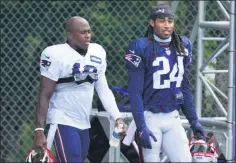  ?? AP PHOTO/STEVEN SENNE, POOL ?? New England Patriots wide receiver Matthew Slater, left, and cornerback Stephon Gilmore, right, step on the field before the start of an NFL football training camp practice, Tuesday, Aug. 25, 2020, in Foxborough, Mass.