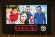  ?? ANDREW KUHN / THE MERCED SUN-STAR VIA AP ?? Images of the family kidnapped at gunpoint are displayed at a news conference in Merced, Calif., on Wednesday. Police said their bodies were found by a farmer.