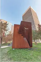  ?? PROVIDED ?? The sculpture “The Kiss” by Oklahoma City artist Klint Schor was installed this fall in downtown OKC at the northeast corner of Robinson and Kerr at Oklahoma Commons.