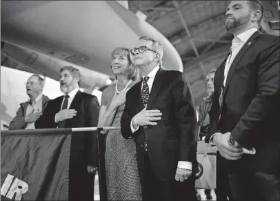 ?? PHOTOS] [BROOKE LAVALLEY/DISPATCH ?? At center, Mike Dewine and his wife, Fran, stand while the All-ohio State Fair Youth Choir sings the national anthem at the National Museum of the United States Air Force.