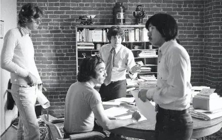  ?? Stephanie Maze / The Chronicle 1975 ?? Rolling Stone’s art director Tony Lane (left), associate editor Abe Peck, co-founder Jann Wenner and senior editor Ben Fong-Torres work in the magazine’s San Francisco office in 1975, two years before the publicatio­n moved to New York.