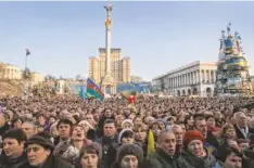  ?? EFREM LUKATSKY, AP ?? Ukrainians sing the national anthem Sunday during a rally in Maidan, Kiev’s central square.