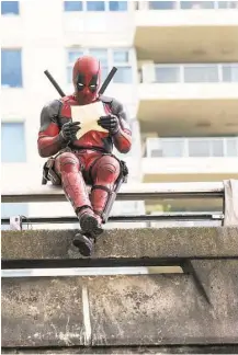  ?? 20th Century Fox ?? Deadpool (Ryan Reynolds) relaxes before leaping into battle in “Deadpool.”