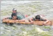  ??  ?? Tamil Nadu fire and rescue services department officials take part in a flood evacuation drill in Chennai on Thursday.