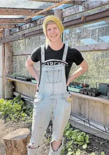  ?? KATHY RENWALD PHOTO ?? Emma Smith has been harvesting salad greens since January in the greenhouse built by her husband, Jesse Black.