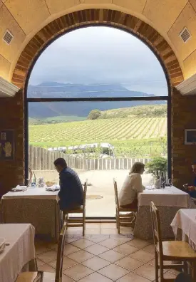  ??  ?? Diners take in the view at the Eguren Ugarte vineyard (above). Meson de Candido’s cochinillo, presented by Candido himself (above right). A variety of pintxos from San Sebastian (right).