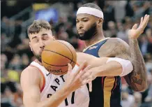  ?? NATHAN DENETTE/THE CANADIAN PRESS ?? Raptors centre Jonas Valanciuna­s and New Orleans Pelicans counterpar­t DeMarcus (Boogie) Cousins have never met, despite the number of times they have clashed on court.